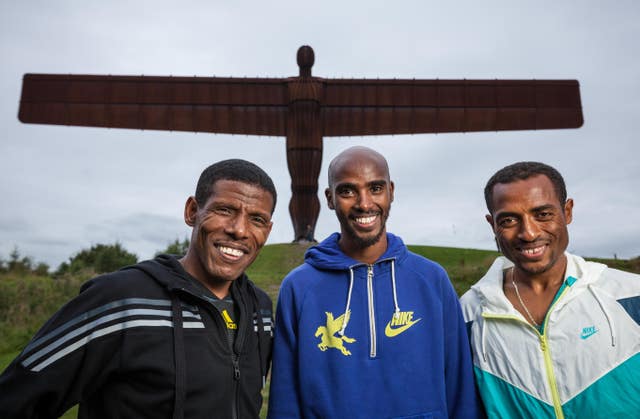Gebrselassie, Farah and Ethiopia’s Kenensia Bekele pose at the Angel of the North 