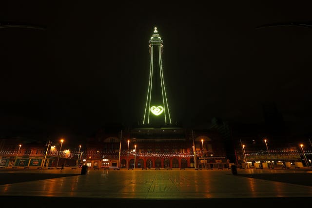 Blackpool Tower is illuminated in yellow to mark the National Day of Reflection 