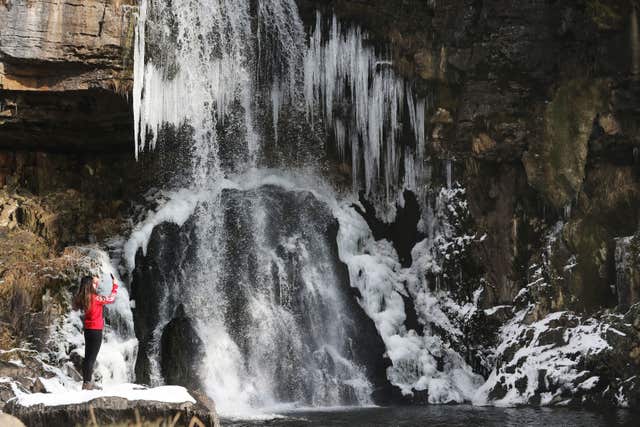 A frozen Ingleton waterfall in North Yorkshire (Owen Humphreys/PA)
