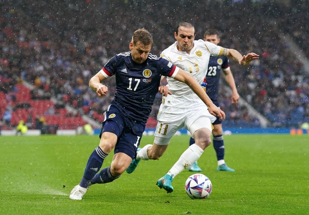 Stuart Armstrong battles for the ball