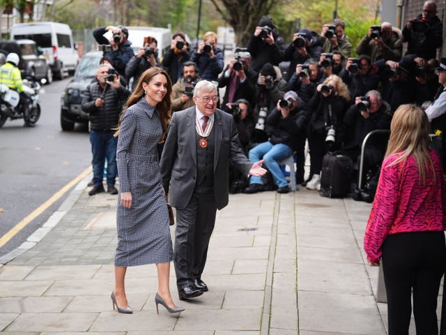 Princess of Wales, with a bank of photographers in the background