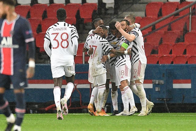 Marcus Rashford celebrates with his Manchester United team-mates after scoring the winner PSG on Tuesday