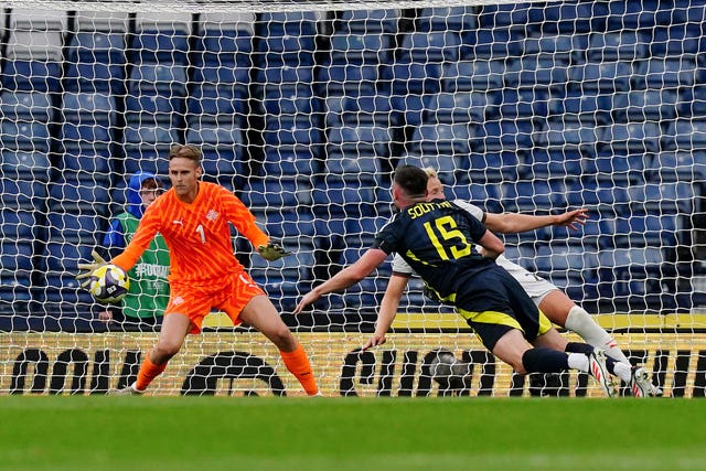 JJohn Souttar dives to head the ball into the Iceland net