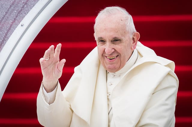 Pope Francis smiling and waving