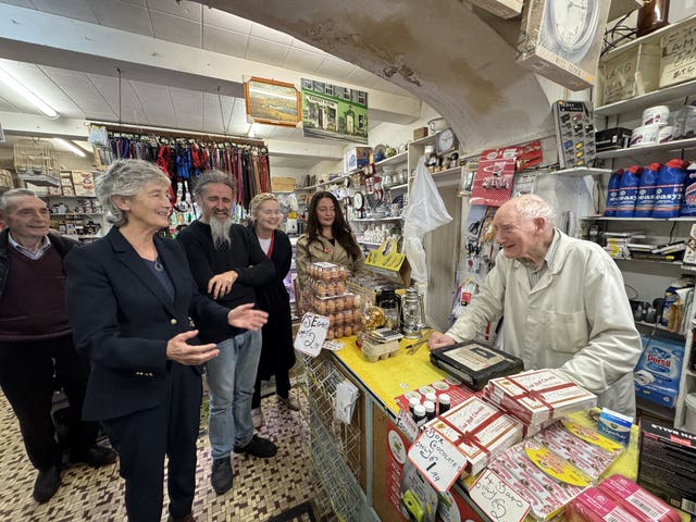 Presidential candidate Catherine Connolly met Tom Flynn, an 87-year-old shopkeeper, in Castlerea