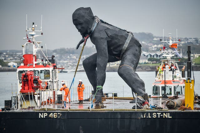 Messenger arrives in Plymouth Sound by barge