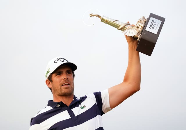 Nacho Elvira celebrates with the Cazoo Trophy after his maiden European Tour victory over Justin Harding in a play-off at Celtic Manor