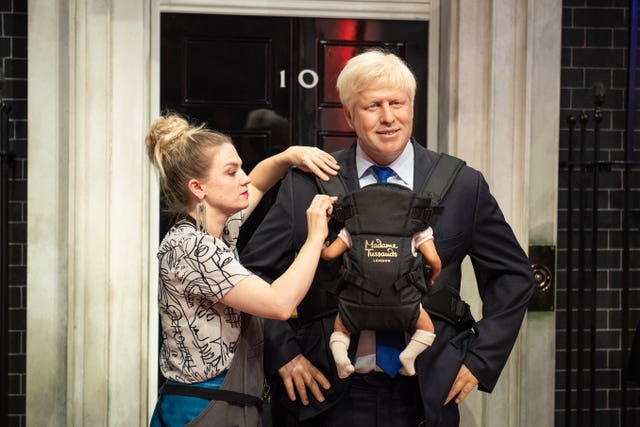 A Madame Tussauds waxwork gives a sneal preview of what Mr Johnson might look like as a doting father