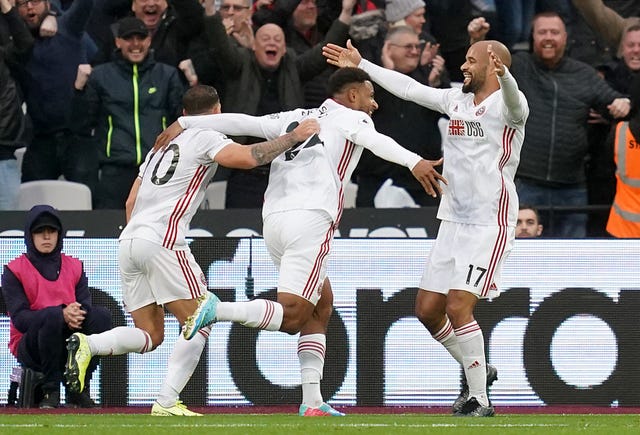 Lys Mousset, centre, celebrates his equaliser 