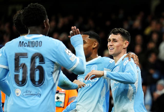 Manchester City’s Phil Foden celebrates scoring a hat-tric