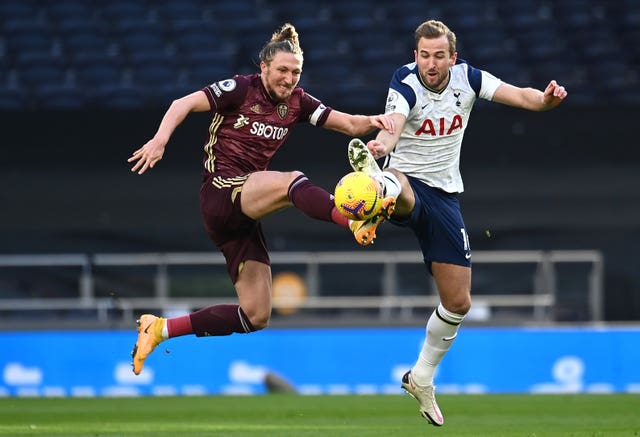 Luke Ayling, left, battles for possession with Tottenham's Harry Kane