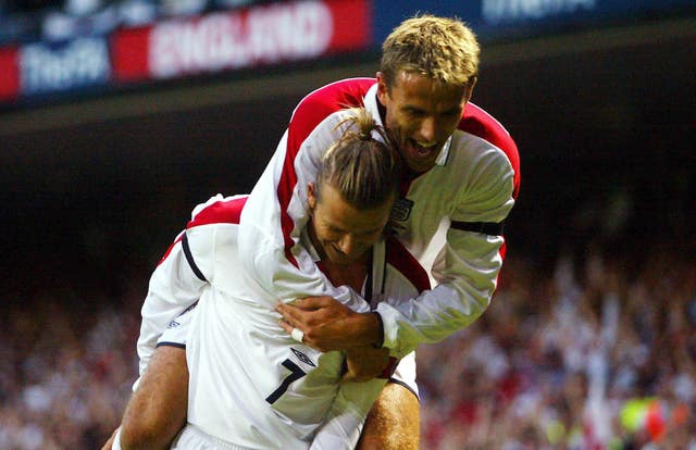 Beckham and Neville are former England and Manchester United team-mates (Andrew Parsons/PA).