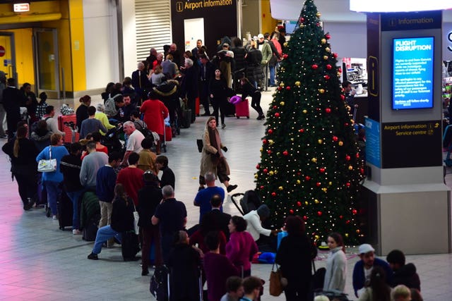 Passengers queue for information at Gatwick