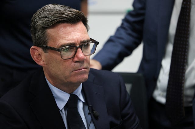 Andy Burnham listens to a journalist's question