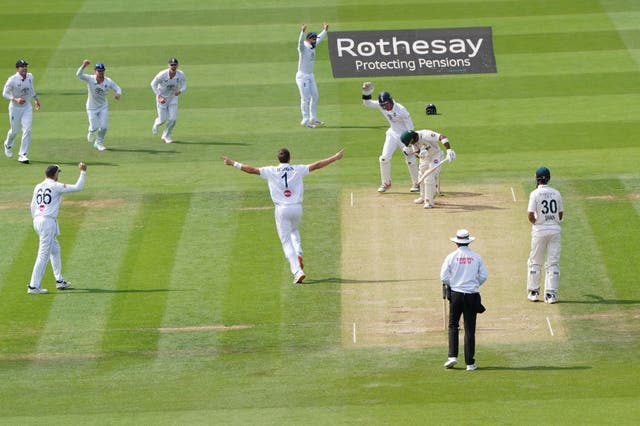 England’s Ollie Robinson, centre, celebrates bowling out Pakistan’s Abdullah Shafique