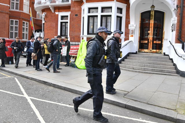 Police officers outside the Ecuadorian Embassy in London