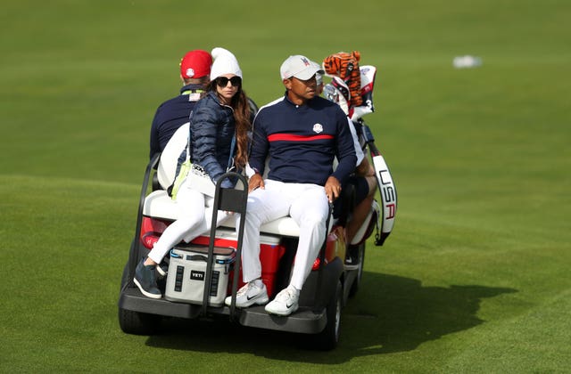 Tiger Woods is whisked away on a buggy at the end of his round (David Davies/PA).