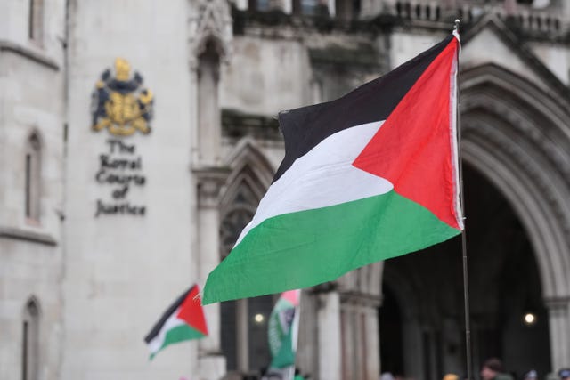 Protesters with Palestinian flags outside the High Court