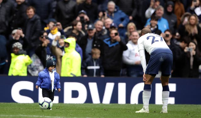 Moura celebrated by having a kickabout with his young son after the match 