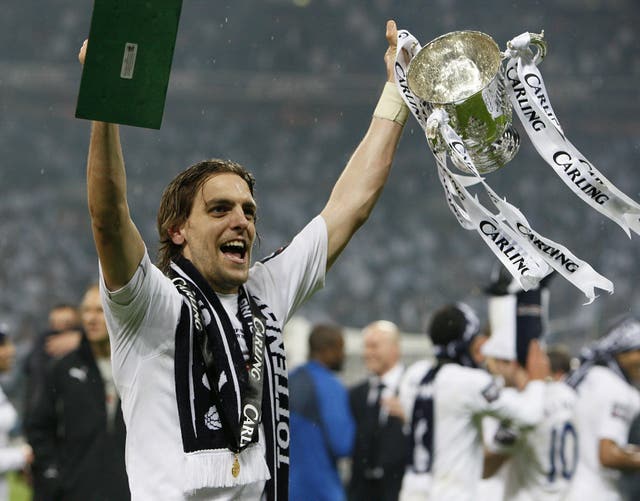 Tottenham's match-winner Jonathan Woodgate celebrates with the Carling Cup