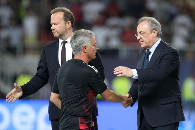 Former Manchester United manager Jose Mourinho (centre) and vice-chairman Ed Woodward (left). (Nick Potts/PA Images)