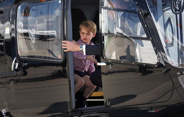 Prince George stands in a rescue helicopter during a visit to Airbus in Hamburg, Germany (Jane Barlow/PA)
