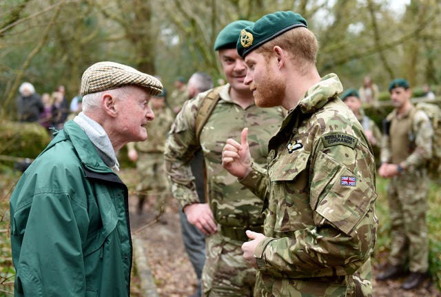 Prince Harry meeting 96-year-old Knocker White, a former Royal Marine (Finnbarr Webster/PA)