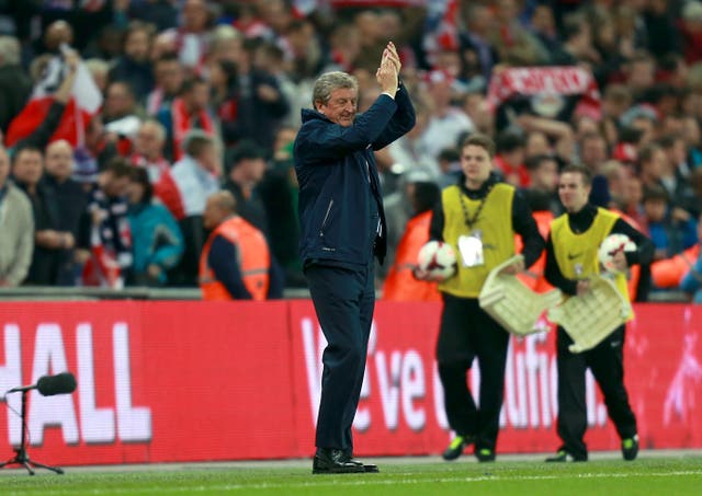 Roy Hodgson applauds England's fans after sealing World Cup qualification