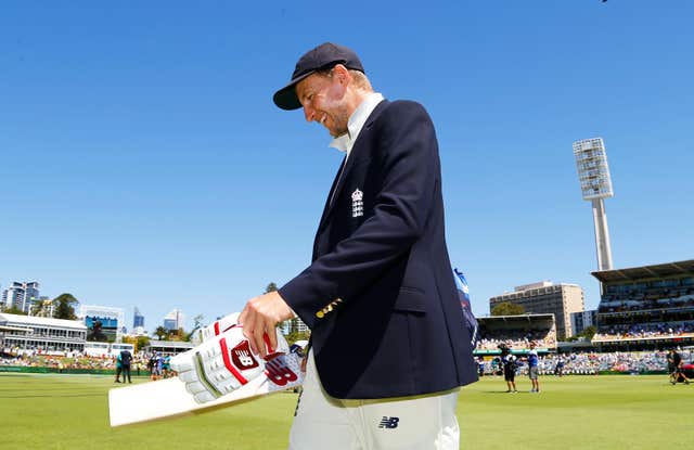 Root in his team blazer after a pre-match coin toss against Australia