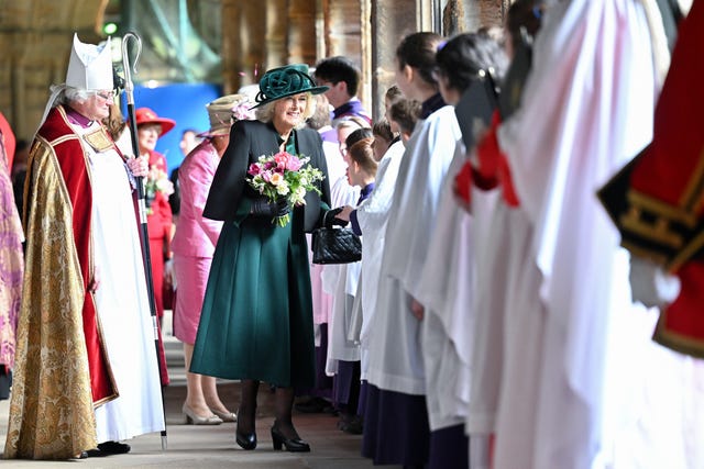 Camilla carrying traditional nosegays as she meets choristers at Durham Cathedral