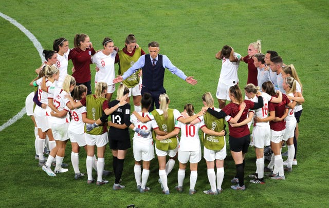 England head coach Phil Neville talks to his players during the World Cup semi-final 