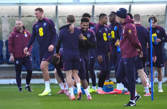 England’s Reece James (centre, facing) with team-mates as head coach Thomas Tuchel looks on