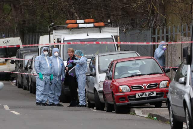 Forensic officers on Further Green Road (Gareth Fuller/PA)