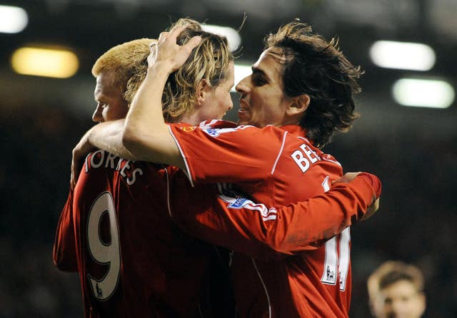 Fernando Torres celebrates his hat-trick with John Arne Riise and Yossi Benayoun