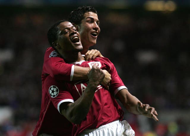Patrice Evra celebrates scoring against Roma with Cristiano Ronaldo in April 2007