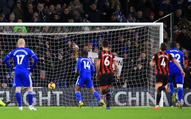 Bobby Reid, second left, scores Cardiff’s first goal from the penalty spot