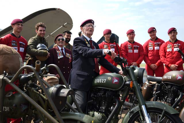 Fred Glover, 92, who served in the parachute regiment during the Second World War, with the new motorcycle (Joe Giddens/PA)