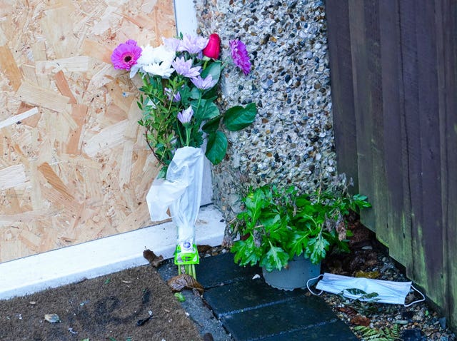 Flowers at the house where Josephine Smith died in a fire