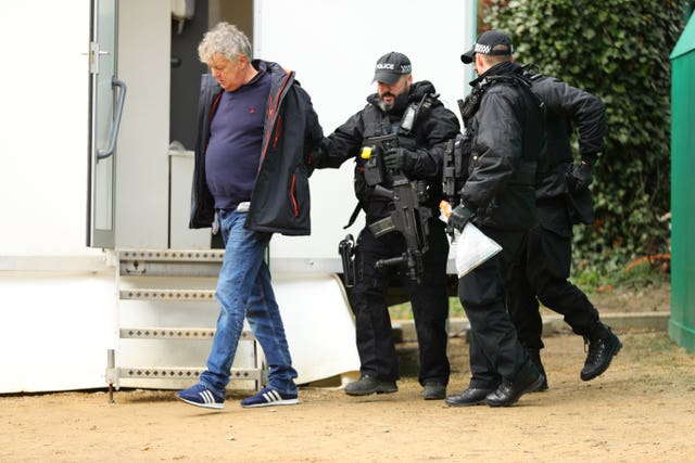 Harry Hicks is led away by armed police following his arrest during Ladies Day (Aaron Chown/PA).