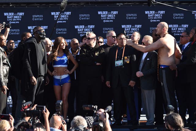 Deontay Wilder and Tyson Fury attend the weigh-in