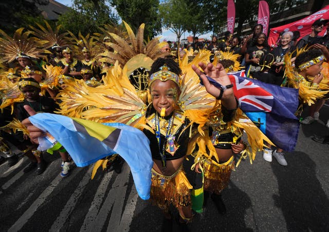 Participants taking part in the family day at the Notting Hill Carnival in London.