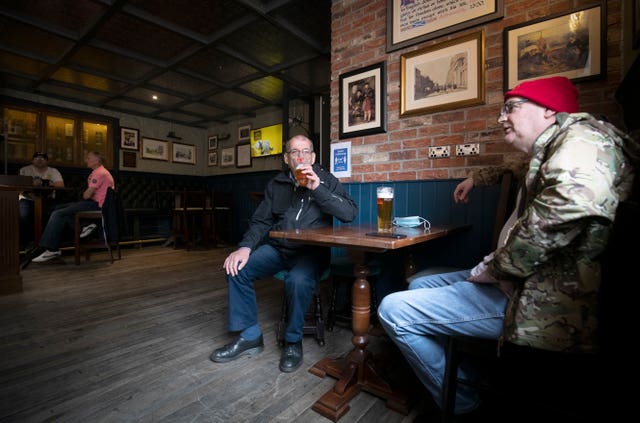 Customers at a pub in Edinburgh