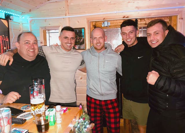 John George, right, with a group of other men