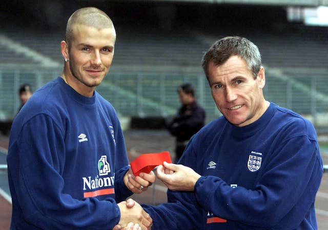 David Beckham is presented the England captain's armband by caretaker manager Peter Taylor in 2000