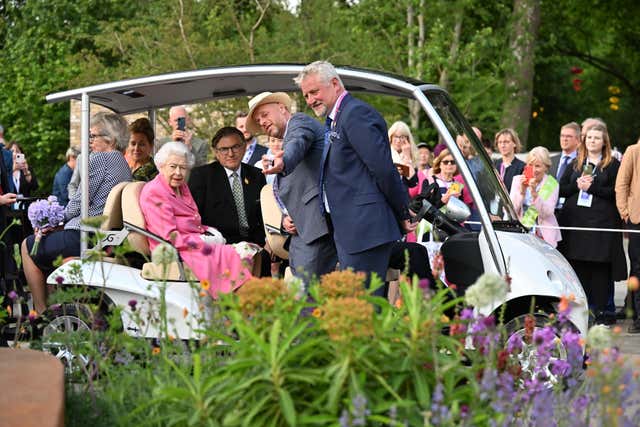 The Queen sitting in a buggy during a visit by members of the royal family to the RHS Chelsea Flower Show
