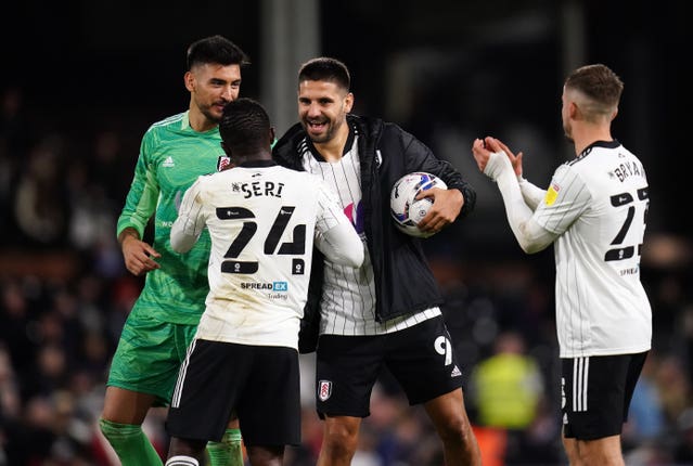 Aleksandar Mitrovic, centre, celebrates his hat-trick against Swansea