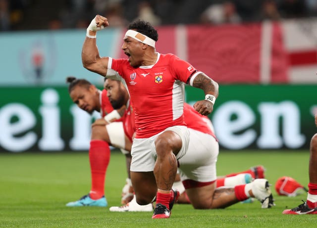 Tonga players perform the Sipi Tau ahead of the match with England