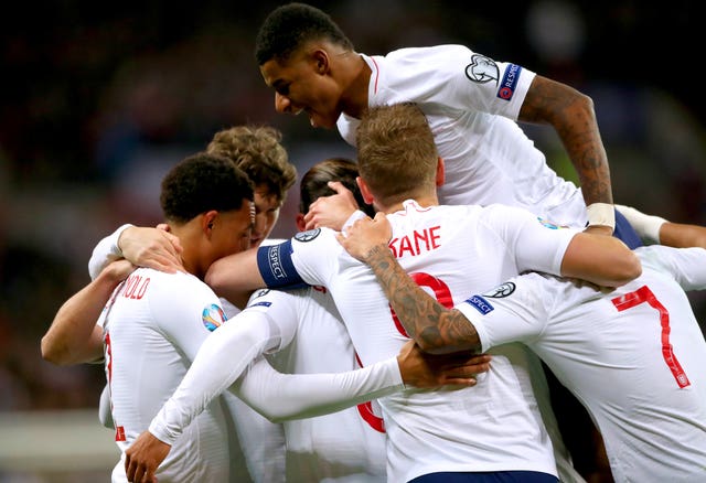England players celebrate as team-mate Alex Oxlade-Chamberlain scores their opening goal 