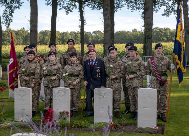 Veteran lays wreath at grave