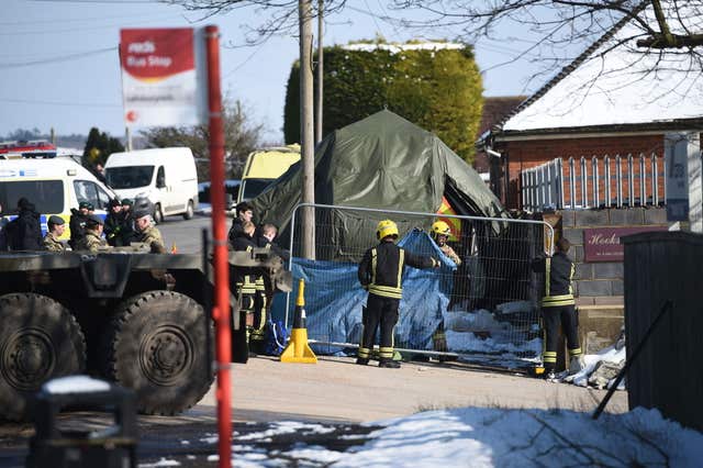 Fire crews sheet off an area on Larkhill Road in Durrington, Salisbury (Ben Birchall/PA)